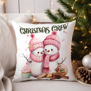 Cozy Christmas Crew pillow cover with snowmen graphics and festive holiday decor background