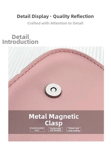 Detailansicht der rosa Ledertasche mit sauberer Naht und silbernem Magnetverschluss
