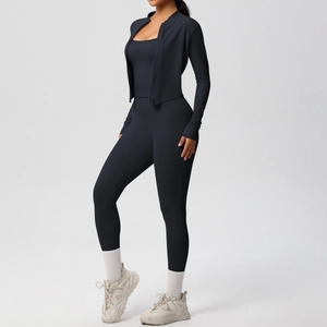 Detailed view of women's 3-piece athletic set featuring zip jacket and high-waisted yoga pants