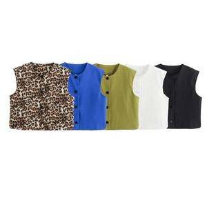 Flat lay of five women's button-down vests in leopard print, blue, green, white, and black