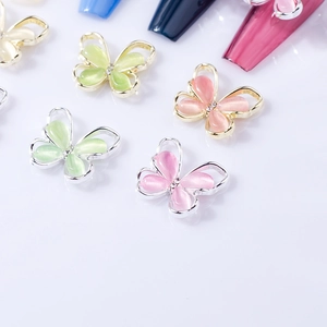 Chic 3D cat eye stone butterfly nail art charms with crystal accents and metal edges