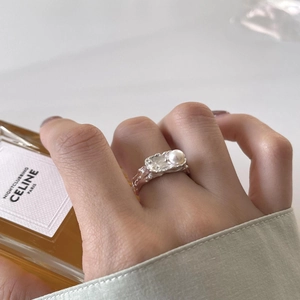 Irregular lava texture S925 silver ring with pearl detail on model finger