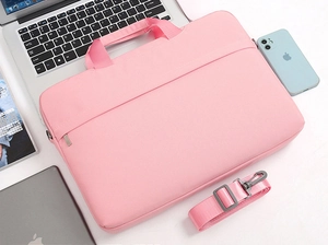 Pink minimalist laptop sleeve with durable canvas fabric and adjustable shoulder strap