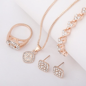 Detailed view of rose gold alloy jewelry set with geometric sparkling crystals