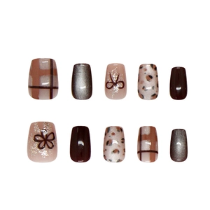 Press-on nail set with plaid patterns leopard prints cat eye finish and bow details