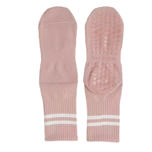 Pink non-slip yoga socks with white stripes and silicone grippers for pilates