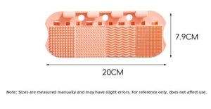 Pink silicone makeup brush cleaning mat with varied textures measuring 20CM x 7.9CM