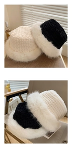 Detailed view of plush faux fur bucket hats in black and cream for winter warmth