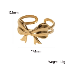 Detailed measurement of gold bow ring showing dimensions 12.5mm by 17.4mm and 1.9g weight