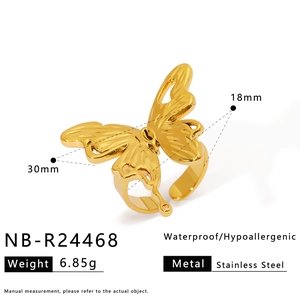 Detail view of golden stainless steel butterfly ring with zircon inlay and product specs