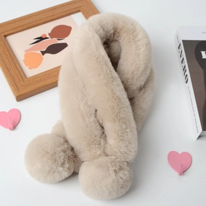 Plush beige faux fur scarf with soft pom-poms for winter warmth and elegant styling