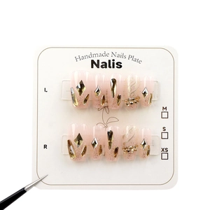 Handmade pink translucent press-on nails with dragon scale glitter and diamond accents