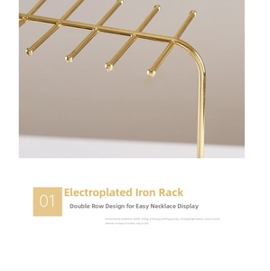 Macro detail of gold plated iron necklace display stand with double row hooks