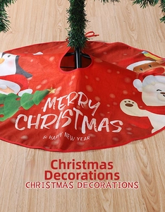 Detail of red Christmas tree skirt featuring festive penguin and polar bear illustrations