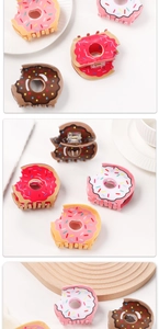 Detailed views of cute donut-shaped hair claws with colorful frosting and sprinkles