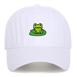 Close-up of a green frog on a lily pad embroidery on a white cotton baseball cap