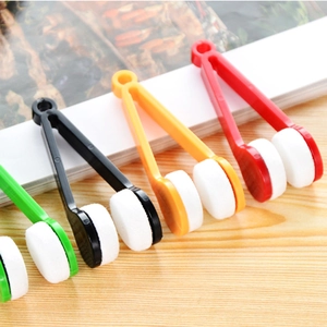 Portable microfiber eyeglass cleaner clips in green, black, yellow, and red colors