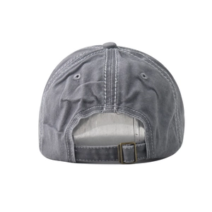 Detail of adjustable metal buckle and vintage washed cotton texture on the back of the cap