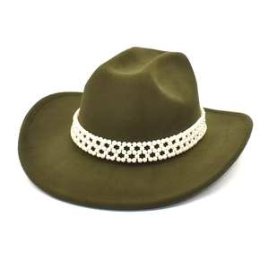 Detail of olive green wool fedora hat featuring an intricate pearl-beaded decorative band