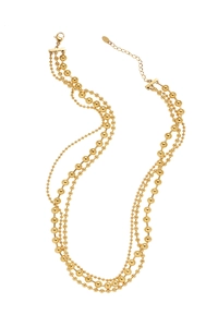 Detailed close-up of triple-layered gold bead necklace with adjustable lobster clasp