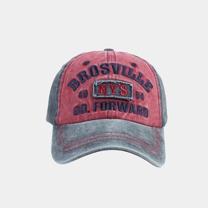 Close-up of vintage washed baseball cap featuring Brosville embroidery and distressed texture