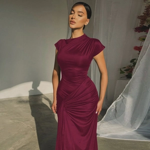 Detail of slim-fit wine red short sleeve dress with textured ruching and tie-waist