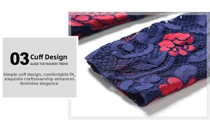Detail of vintage long dress sleeve featuring navy lace and red floral embroidery