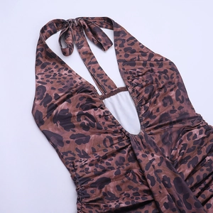 Close-up of leopard print mini dress featuring halter neck tie and deep V-neckline detail