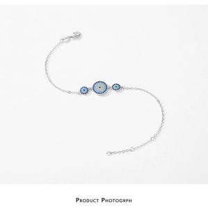 Detailed shot of S925 silver Evil Eye bracelet with turquoise inlays and lobster clasp