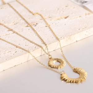 Double-layered 18K gold plated stainless steel necklace with sun and moon pendants