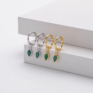 Detail of S925 sterling silver hoop earrings with pear-cut green zircon drops