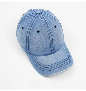 Detailed top view of light blue washed denim baseball cap with premium stitching detail