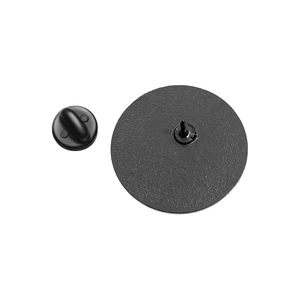 Detail of black metal brooch base with sharp pin and secure rubber clutch closure