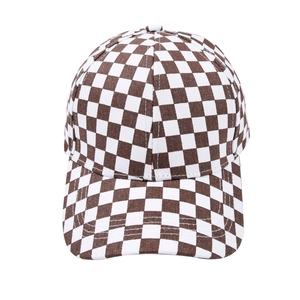 Brown and white checkerboard baseball cap with a classic curved brim on white background