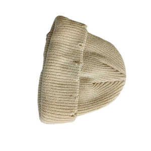 Detailed close-up of the beige knitted texture and folded cuff on this winter beanie