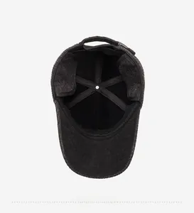 Detail view of winter baseball cap with thick fleece lining and folding ear flaps