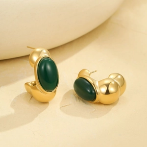 French vintage style chunky gold C-shaped earrings with emerald green gemstones