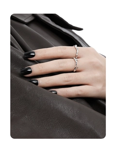 Irregular silver vine ring with micro-set zircon stones on model's hand