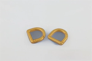 Close-up of 20mm golden D-ring spring buckle for handbag strap repair and DIY hardware