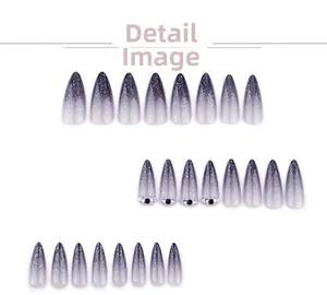 Macro shot of 24pcs stiletto press-on nails with grey gradient, glitter, and rhinestones