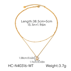 Detailed view of double-layered gold stainless steel necklace with white rectangular pendant