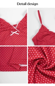 Detail view of red polka dot top featuring V-neckline, white trim, and small bow decoration