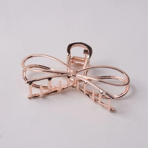 Detailed view of rose gold alloy butterfly hair claw clip with hollow metal lines