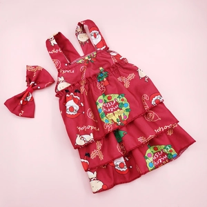 Detail of baby Christmas dress set with floral reindeer print and matching bow headband