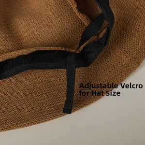 Close-up of adjustable velcro strap and sweatband inside a brown woven sun hat