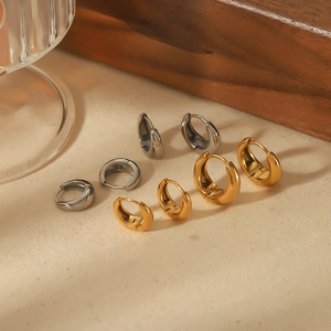 U-shaped stainless steel hoop earrings in gold and silver finish for a minimalist style