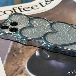 Detail of silver electroplated heart phone case with glitter for iPhone 15 Pro Max