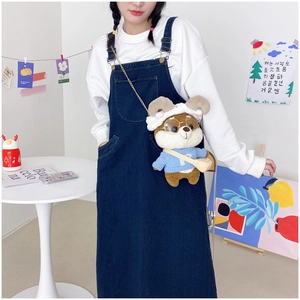 Detail view of cute Shiba Inu plush crossbody bag with blue sweater and gold chain strap