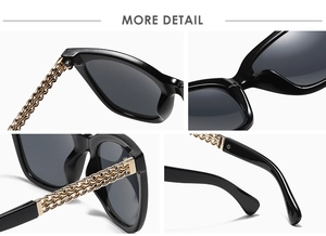 Macro detail of cat eye sunglasses showing gold chain temples and polished hinges
