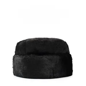 Close-up of thick black faux fur winter hat with soft texture for outdoor thermal protection